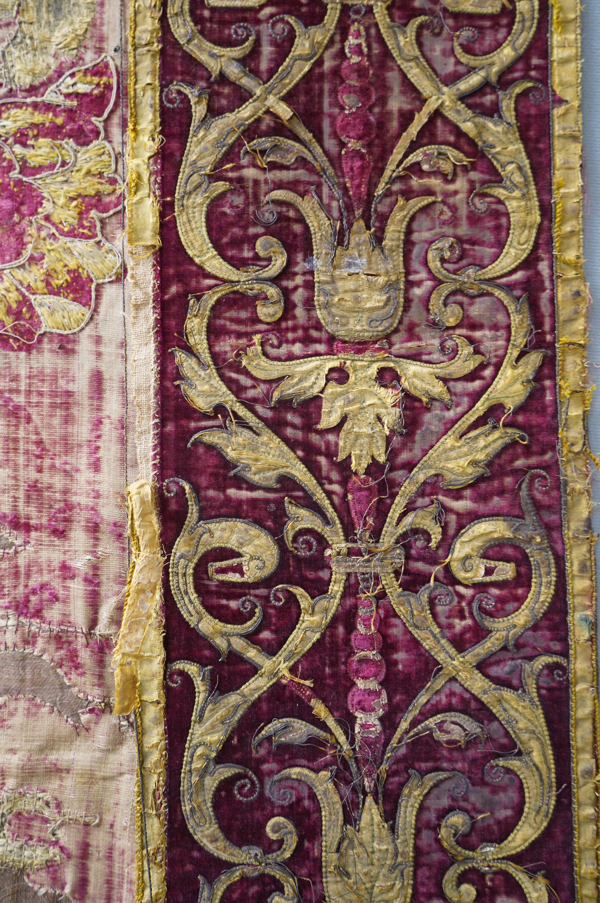 A fine Italian Renaissance style velvet, embroidered and appliqué wall hanging, originally part of a pilaster hanging, made with crimson silk velvet, gold appliqué and colourful polychrome silk embroideries of parrots an